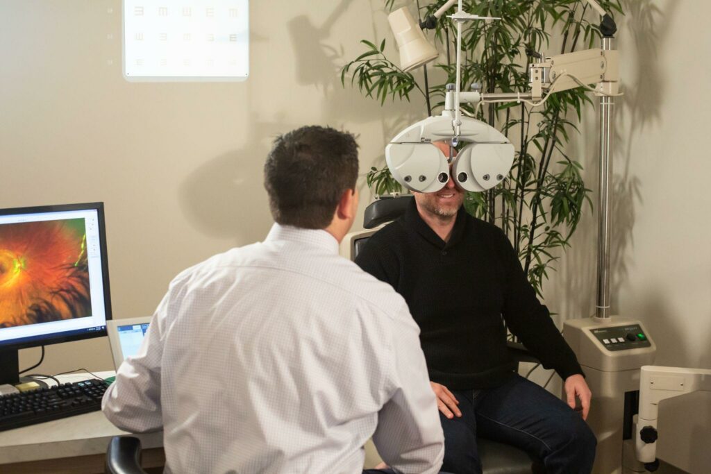 a patient getting their eyes checked at a routine eye exam with an eye doctor in Boise