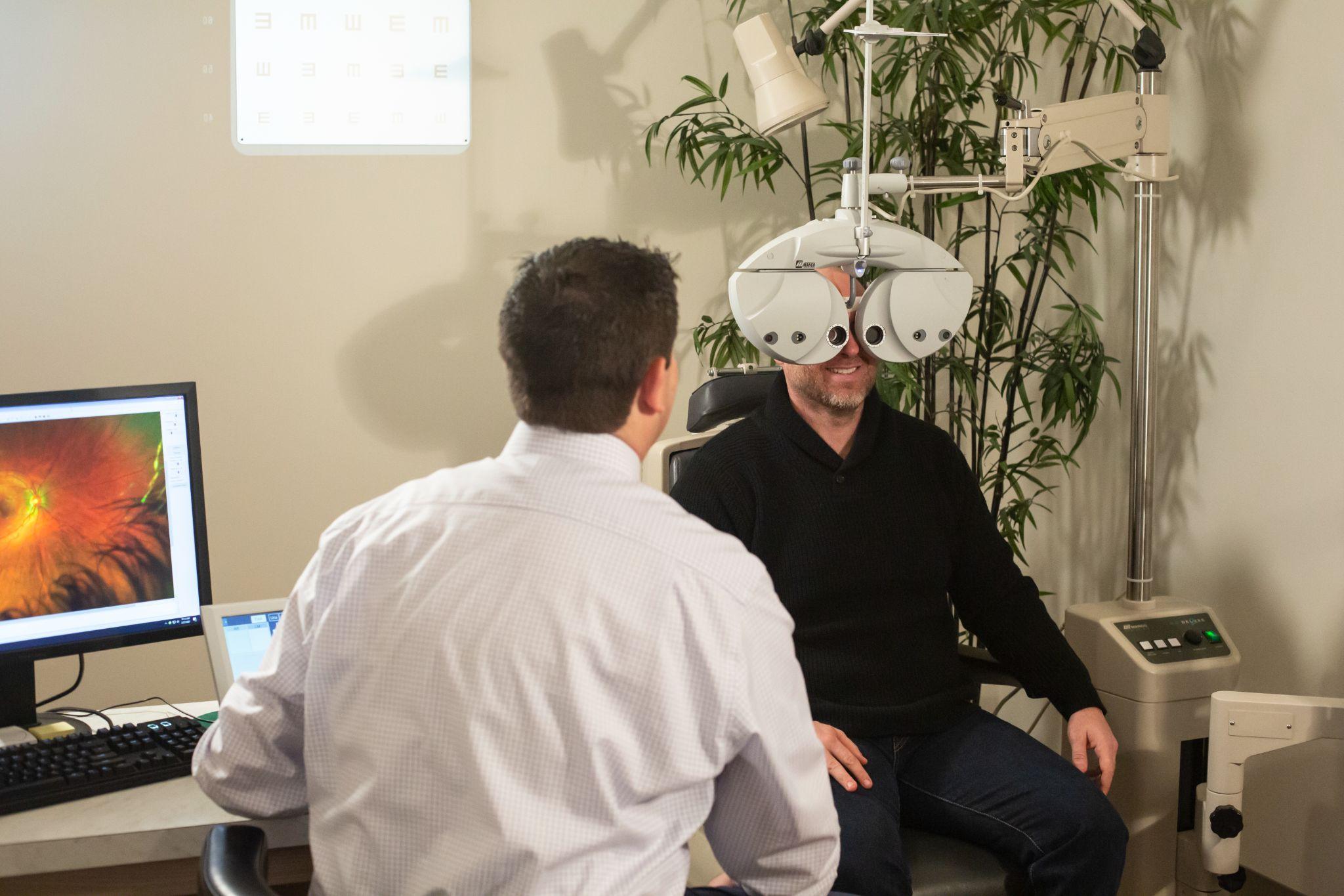 a patient getting their eyes checked at a routine eye exam with an eye doctor in Boise